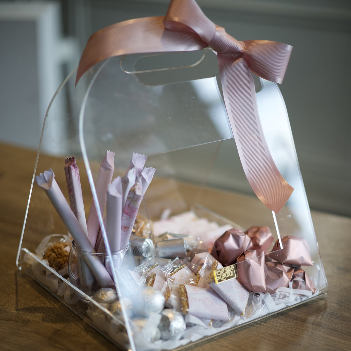 The Blush Carry Case, the full case with its carry handle and blush bow