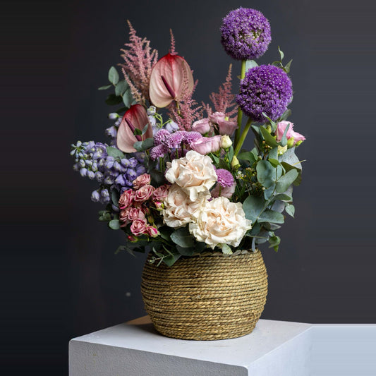 Lavender and blush luxury garden basket in a woven seagrass vessel
