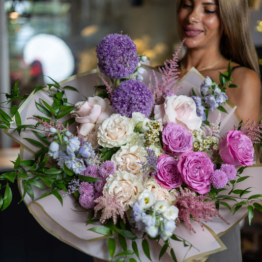 The Lilac Bloom Bouquet, the full bouquet, held