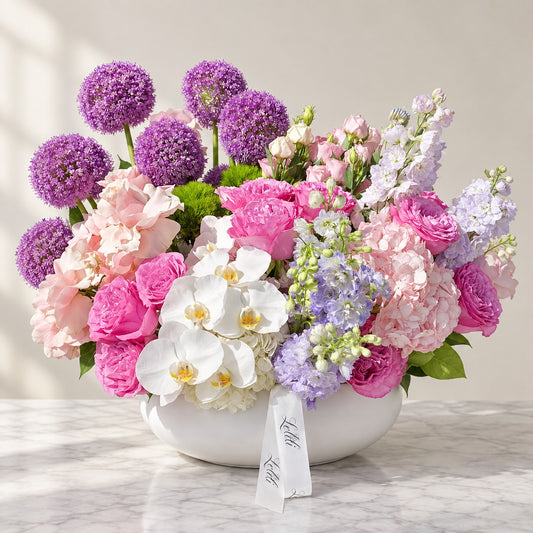 The Orchid Blush Arrangement, the full arrangement in its white ceramic bowl